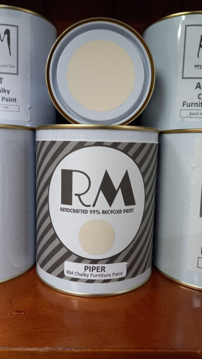 Can of RM chalky furniture paint with 'Piper' color on a wooden surface